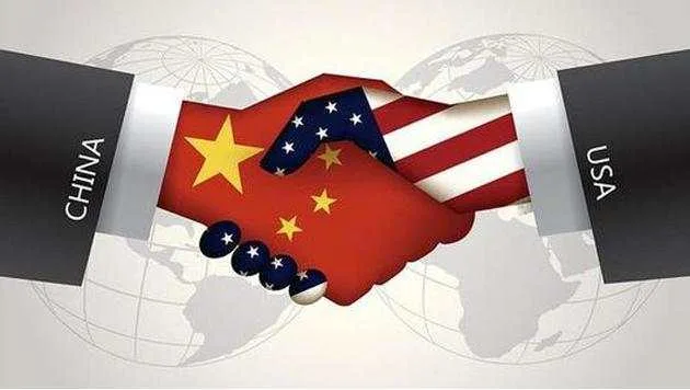 Illustration of a handshake where one hand is patterned with the U.S. flag and the other with the Chinese flag, representing cooperation between the United States and China.